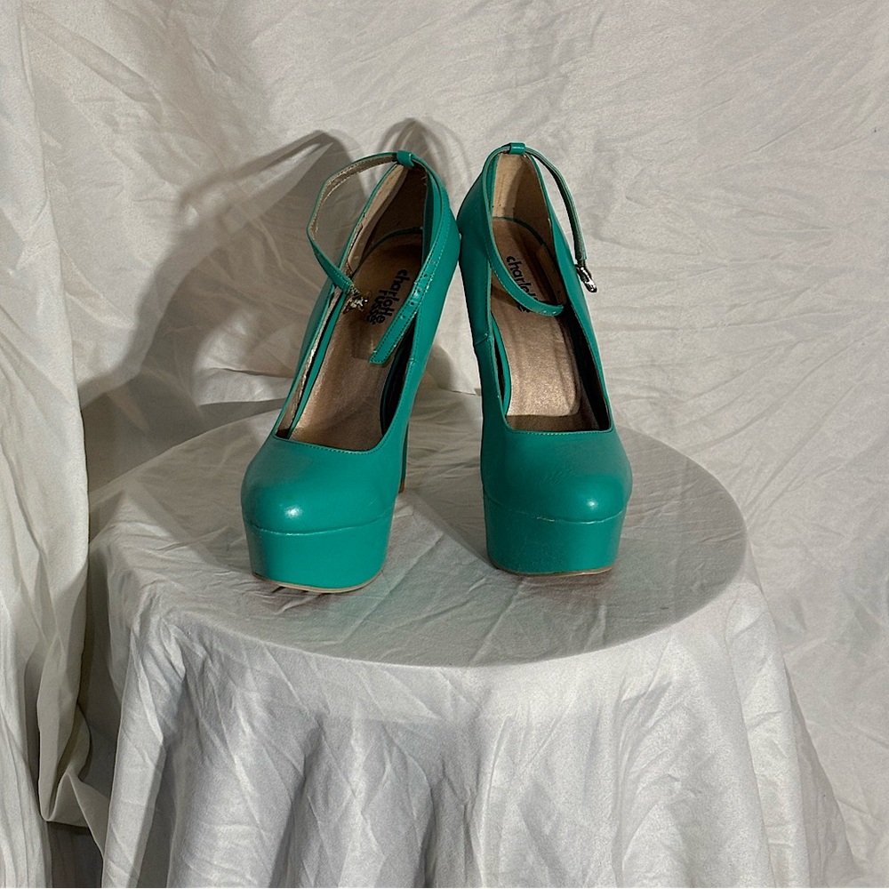 Turquoise platform heels with ankle clasp, lightly worn.